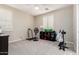 This versatile bedroom offers ample space for exercise equipment, features neutral colors, and has bright, natural light at 2851 E Alexander Ct, Gilbert, AZ 85298