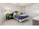 Well-lit bedroom with modern accents and a large window is an oasis for comfort and relaxation at 2851 E Alexander Ct, Gilbert, AZ 85298