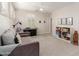 Bonus room features a comfortable couch, an abundance of natural light, and versatile space for an office or living area at 2851 E Alexander Ct, Gilbert, AZ 85298
