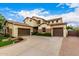 Spacious two-story home showcasing a tile roof, three-car garage, and a circular driveway at 2851 E Alexander Ct, Gilbert, AZ 85298