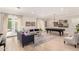 Bright living room with a pool table, comfortable seating, and views of the outdoor pool area at 2851 E Alexander Ct, Gilbert, AZ 85298