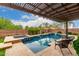 Beautiful backyard features a covered patio, a pool, and a spa, creating a perfect outdoor oasis at 2851 E Alexander Ct, Gilbert, AZ 85298