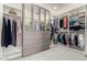 Spacious walk-in closet with mirrored dresser, shelving, and ample hanging space for clothing and accessories at 2851 E Alexander Ct, Gilbert, AZ 85298