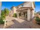 Backyard with paver patio extending from covered porch and nicely landscaped at 2868 E Binner Dr, Chandler, AZ 85225
