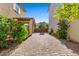Wide backyard with brick pavers, covered patio, and greenery at 2868 E Binner Dr, Chandler, AZ 85225