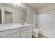 Well-lit bathroom features a tub/shower combination, large mirror, and a white vanity at 2868 E Binner Dr, Chandler, AZ 85225