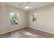 Sunny bedroom with hardwood floors and multiple windows providing ample natural light at 2868 E Binner Dr, Chandler, AZ 85225