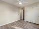 Bedroom with light wood vinyl flooring, a ceiling fan, and sliding door closet at 2868 E Binner Dr, Chandler, AZ 85225