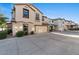 Two-story home featuring a tile roof and paved driveway leading to an attached garage at 2868 E Binner Dr, Chandler, AZ 85225