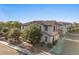 Exterior view of a two-story home featuring a tile roof and mature landscaping with mature trees at 2868 E Binner Dr, Chandler, AZ 85225
