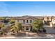 Two story home featuring a tile roof, landscaped yard with mature trees and covered porch at 2868 E Binner Dr, Chandler, AZ 85225