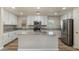 Updated kitchen features white cabinets, stainless steel appliances, and a center island at 2868 E Binner Dr, Chandler, AZ 85225