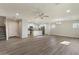 Open-concept living area with new floors flowing into a modern kitchen with a center island at 2868 E Binner Dr, Chandler, AZ 85225