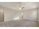 An unfurnished carpeted living room with a ceiling fan and neutral walls at 2868 E Binner Dr, Chandler, AZ 85225
