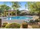 Resort-style community pool and lounge area with cabana and lush landscaping at 2868 E Binner Dr, Chandler, AZ 85225