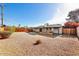 Backyard with gravel, wood fence, and covered patio at 3532 N Carhill Ave, Scottsdale, AZ 85251