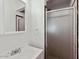 Bathroom featuring a shower with glass doors, mirror, and sink basin at 3532 N Carhill Ave, Scottsdale, AZ 85251