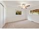Bright bedroom with neutral carpet, closet space and two windows at 3532 N Carhill Ave, Scottsdale, AZ 85251