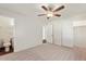 Cozy bedroom with neutral carpet and adjacent bathroom at 3532 N Carhill Ave, Scottsdale, AZ 85251