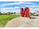 The Scottsdale LOVE sculpture is showcased in a beautiful outdoor community area at 3532 N Carhill Ave, Scottsdale, AZ 85251