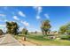 A golf course on a sunny day. Featuring trees, fairways, and golf carts at 3532 N Carhill Ave, Scottsdale, AZ 85251