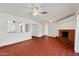 Spacious living room with brick fireplace and retro tile flooring at 3532 N Carhill Ave, Scottsdale, AZ 85251