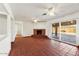 Open living room with brick fireplace and sliding glass door to patio at 3532 N Carhill Ave, Scottsdale, AZ 85251