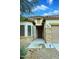 Close-up of the front entrance, showcasing the stone accents and well-manicured landscaping at 36950 W Mondragone Ln, Maricopa, AZ 85138