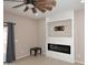 Living room featuring a fireplace at 36950 W Mondragone Ln, Maricopa, AZ 85138