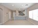 Bright, open-concept living room features hardwood floors and modern fixtures, ideal for entertaining at 36950 W Mondragone Ln, Maricopa, AZ 85138