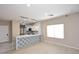 The bright living room offers an open floor plan and scenic windows at 36950 W Mondragone Ln, Maricopa, AZ 85138