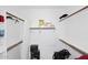 Walk-in closet with shelving and storage for clothing and personal belongings at 36950 W Mondragone Ln, Maricopa, AZ 85138