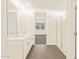 Bright bathroom showcasing double sinks, walk-in shower, and modern finishes at 37125 W Prado St, Maricopa, AZ 85138