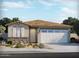 Charming single-story home featuring a two-car garage, stone accents, and a well-manicured front yard at 37125 W Prado St, Maricopa, AZ 85138