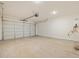 Spacious two-car garage with concrete flooring and automatic door opener at 37125 W Prado St, Maricopa, AZ 85138