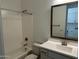 Clean bathroom featuring a shower-tub combination, a toilet, and a vanity with framed mirror at 3738 E Rochelle Cir, Mesa, AZ 85213