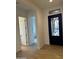 Stylish entryway featuring a decorative front door, neutral paint, and modern flooring, creating a welcoming atmosphere at 3738 E Rochelle Cir, Mesa, AZ 85213