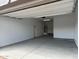 Clean, spacious garage with ample lighting and storage, ideal for parking and home projects at 3738 E Rochelle Cir, Mesa, AZ 85213