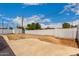 Spacious backyard featuring a concrete patio and block fence, ready for customization at 3828 W Townley Ave, Phoenix, AZ 85051