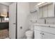 A stylish bathroom features a vanity and view of the kitchen at 3828 W Townley Ave, Phoenix, AZ 85051