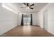 This is a bright bedroom with a ceiling fan and wood-look floors at 3828 W Townley Ave, Phoenix, AZ 85051
