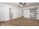 A bright bedroom with wood-look floors and a sliding barn door at 3828 W Townley Ave, Phoenix, AZ 85051