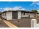 Exterior view of a single-story home showcasing clean lines and a well-maintained facade at 3828 W Townley Ave, Phoenix, AZ 85051