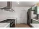 The kitchen has stainless steel appliances, green cabinets, and light countertops at 3828 W Townley Ave, Phoenix, AZ 85051