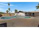 Private backyard featuring a refreshing swimming pool and rock landscaping at 407 E Orion St, Tempe, AZ 85283