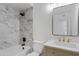 Modern bathroom with decorative tile, gold fixtures, and framed mirror at 407 E Orion St, Tempe, AZ 85283