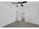 Neutral bedroom with a ceiling fan, carpet and open closet space at 407 E Orion St, Tempe, AZ 85283
