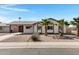 Charming single-story home with desert landscaping and mature palm trees enhancing curb appeal at 407 E Orion St, Tempe, AZ 85283