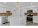 Bright kitchen with white cabinets, stainless steel appliances, and a stylish island at 407 E Orion St, Tempe, AZ 85283