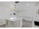 Spacious kitchen with white cabinetry, a large island, and ample natural light at 407 E Orion St, Tempe, AZ 85283